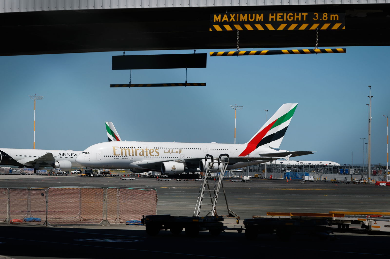 Emirates and Qatar Airways planes parked at Auckland International Airport. Photo / Michael Craig