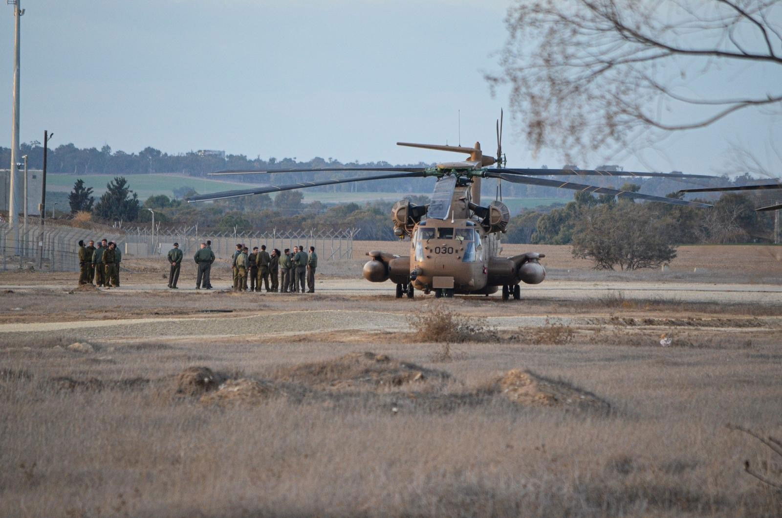 A helicopter in a field.