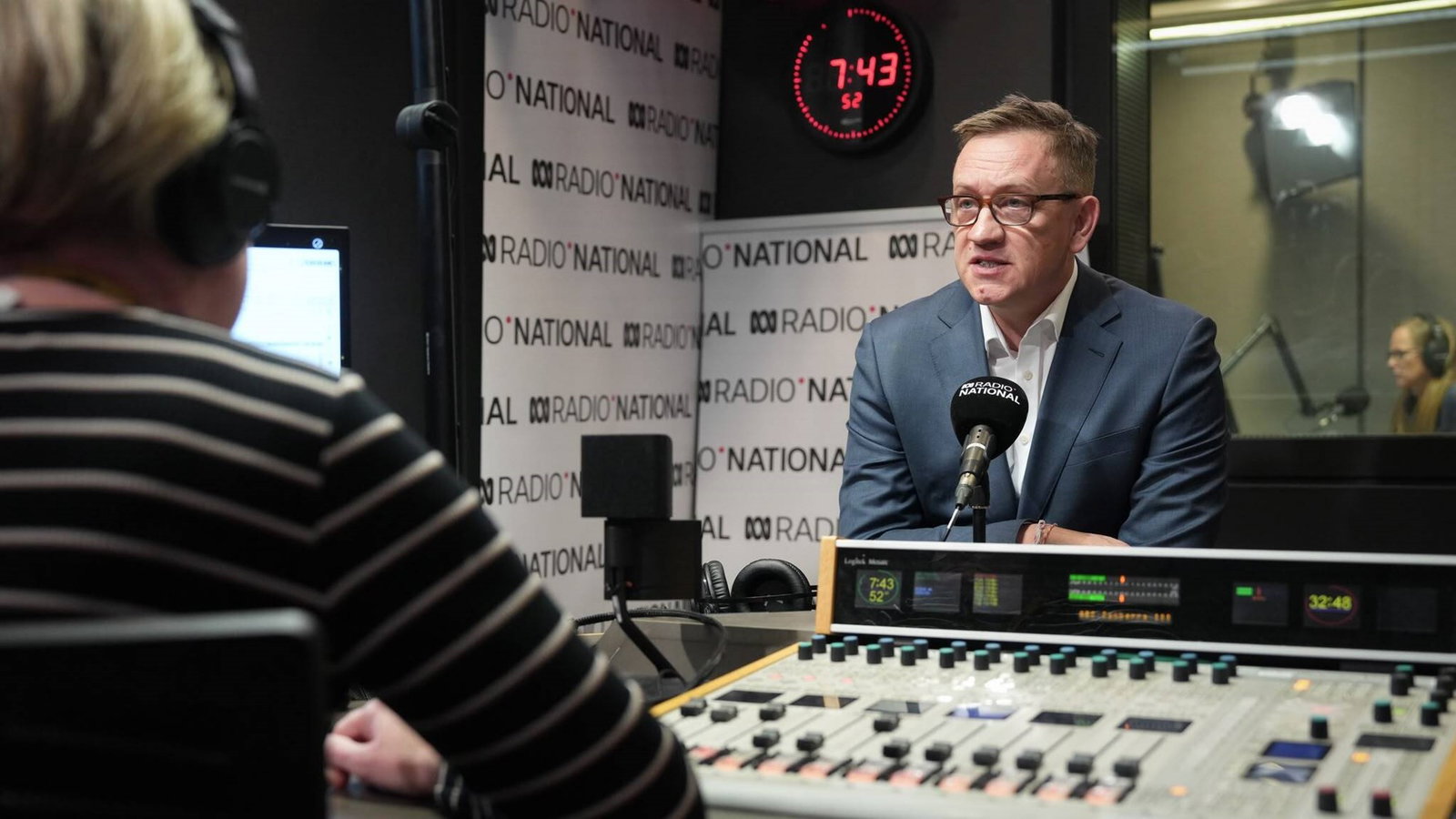 Julian Hill speaks to Sally Sara in a radio studio.