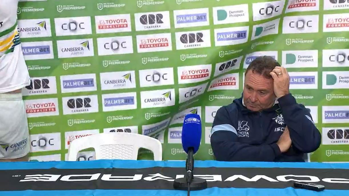 Canberra Raiders coach Ricky Stuart scratches his head at a press conference.