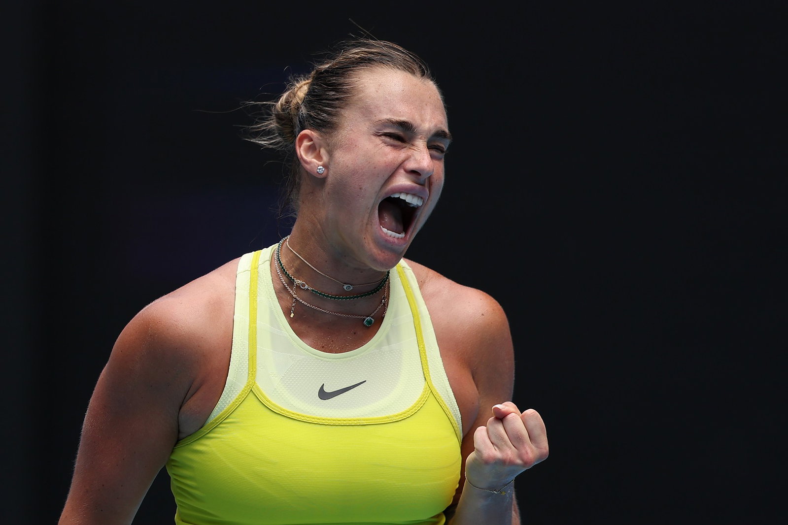 Aryna Sabalenka clenches her fist and shouts at the Australian Open.