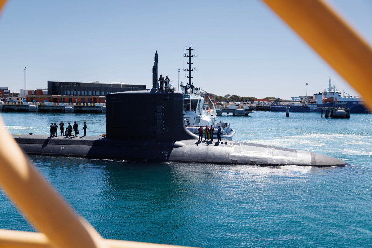 A submarne floats just above the surface.