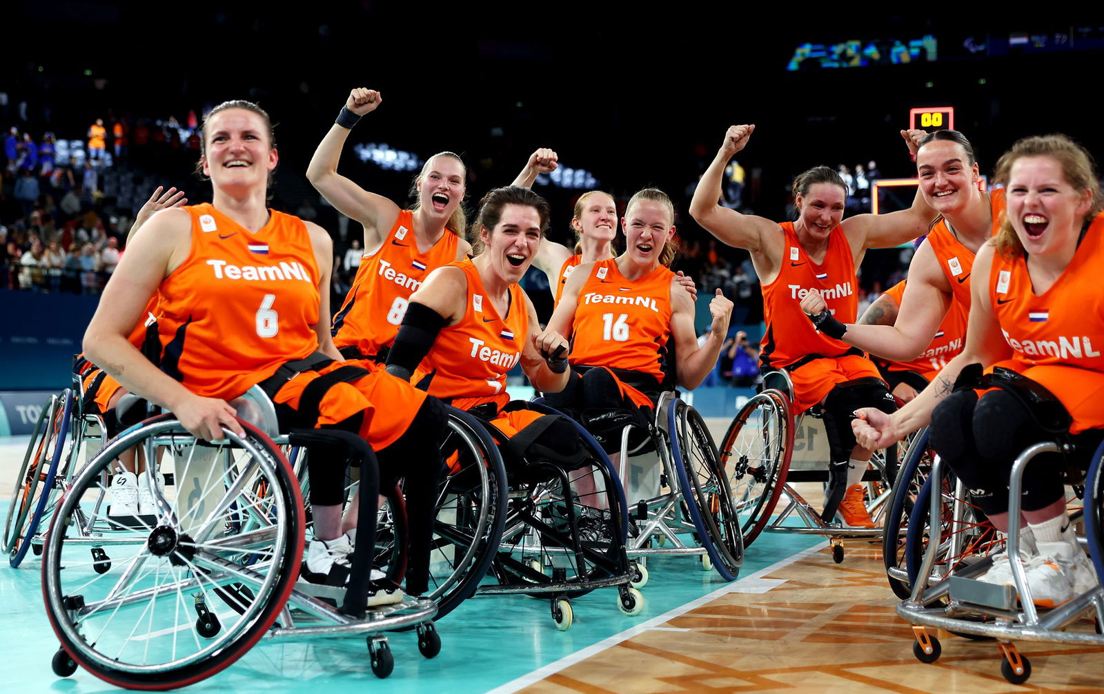 Dutch women's wheelchair basketball team celebrates a win in their semifinal match against Canada.