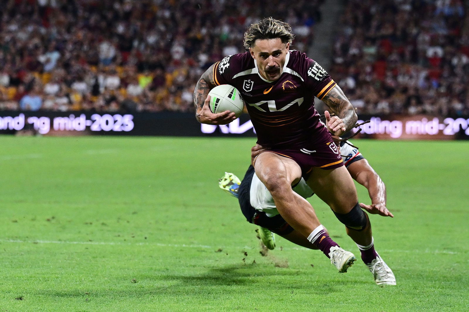 Brisbane Broncos winger Jesse Arthurs running with the ball.