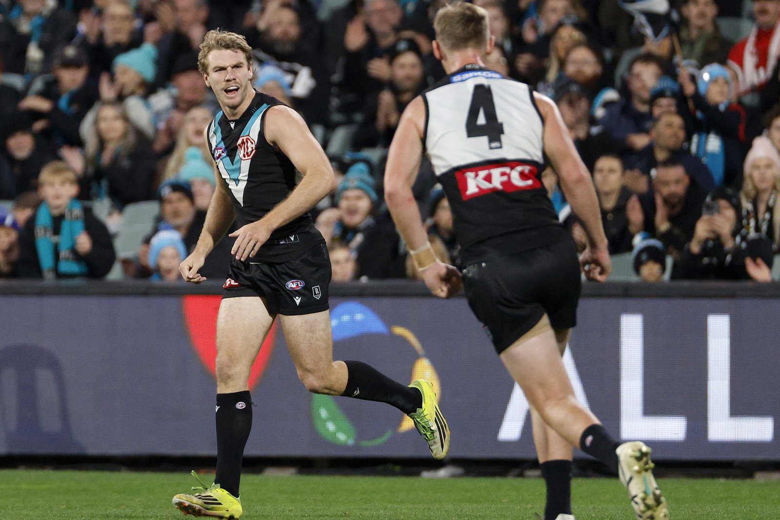 Jason Horne-Francis (left) kicked one of Port's three goals in the first quarter against Sydney.