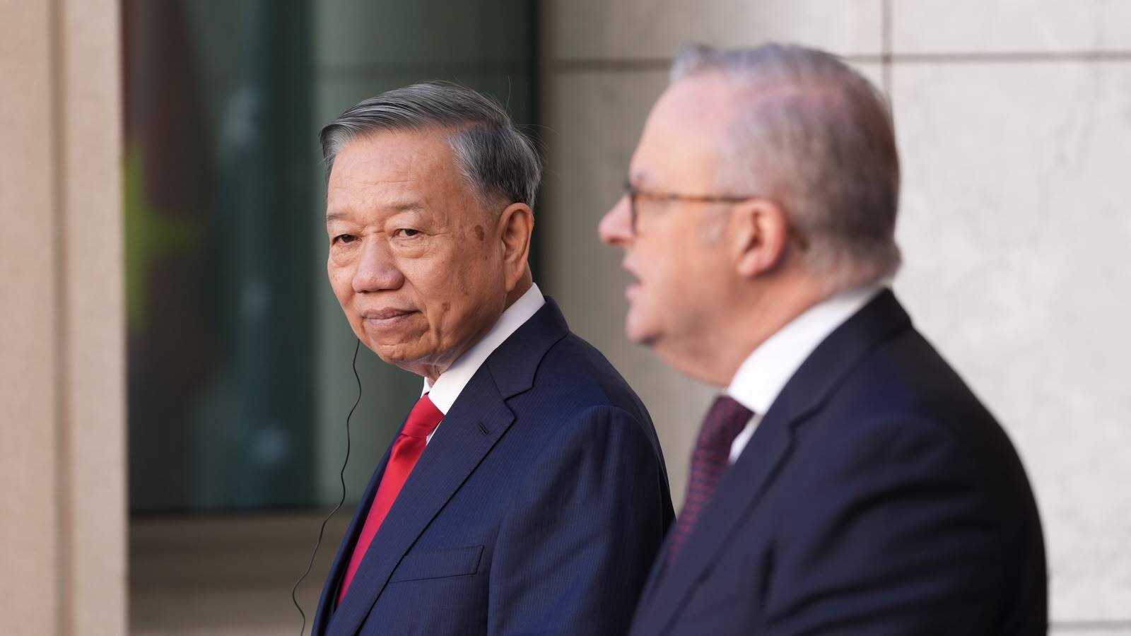 To Lam stands next to Anthony Albanese.