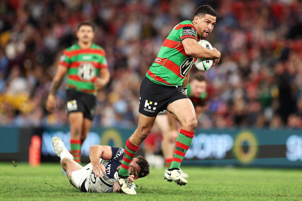 South SYdney's Cody Walker breaks free of a Cowboys' player's tackle.