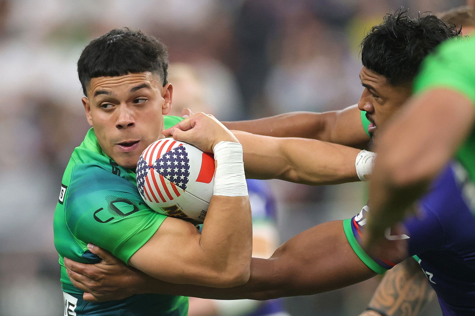 Raiders winger Savelio Tamale runs into the defence of the Warriors