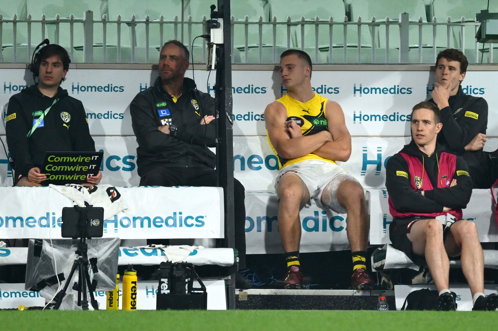 A disappointed Sam Lalor of the Tigers sits on the bench during the round 11 AFL match between Essendon Bombers and Richmond Tigers at Melbourne Cricket Ground, on May 23, 2025, in Melbourne, Australia.
