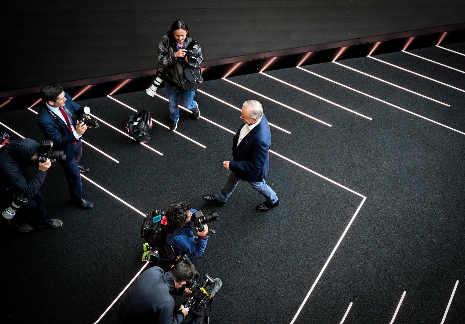 a man in a suit walking 