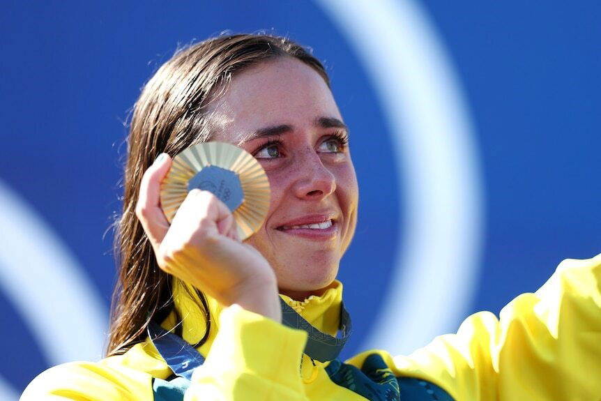 Noemie Fox smiles with her gold medal