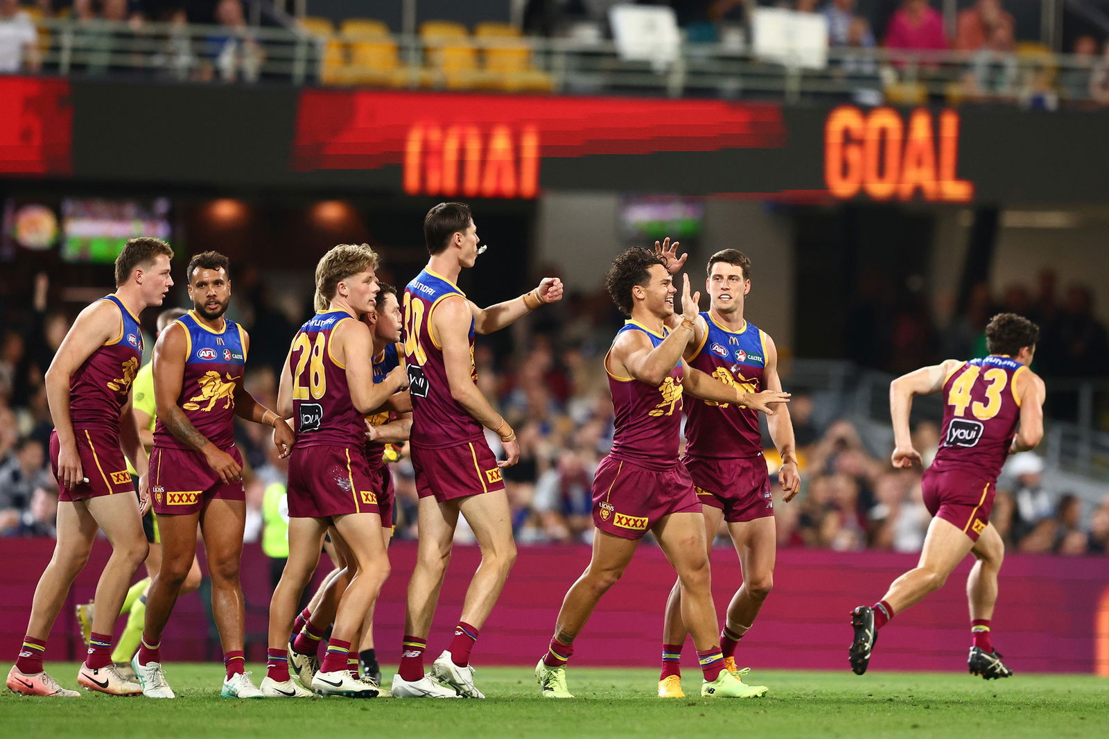 Lions players celebrate a goal