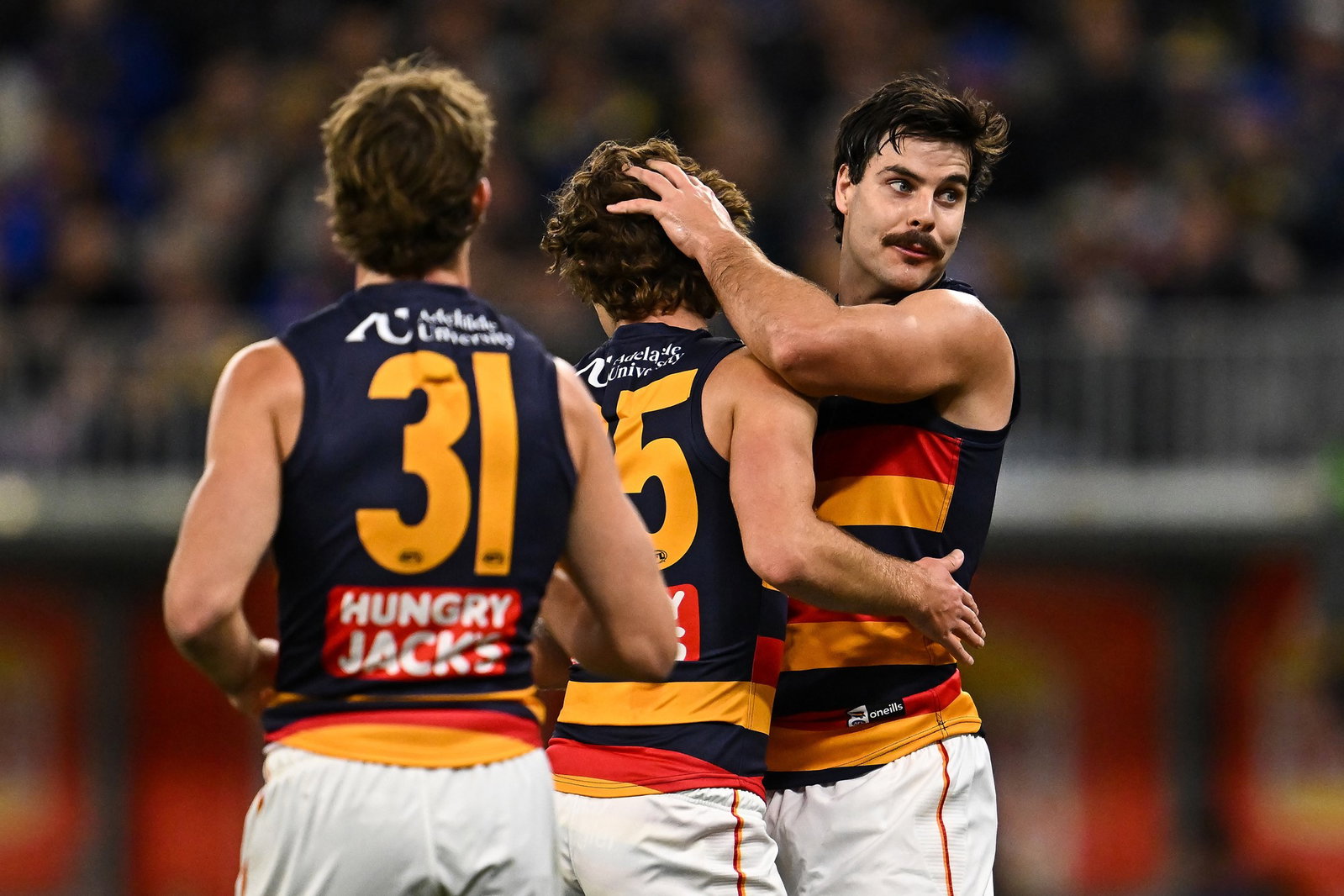 Darcy Fogarty (right) kicked three of Adelaide's six first-quarter goals against West Coast.