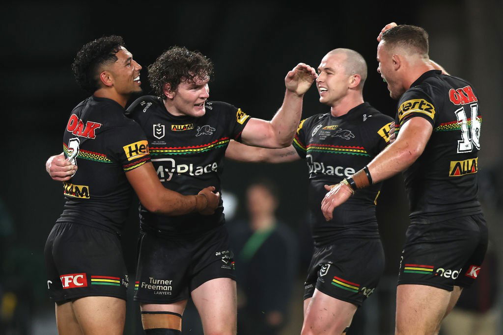 Penrith Panthers players hug.