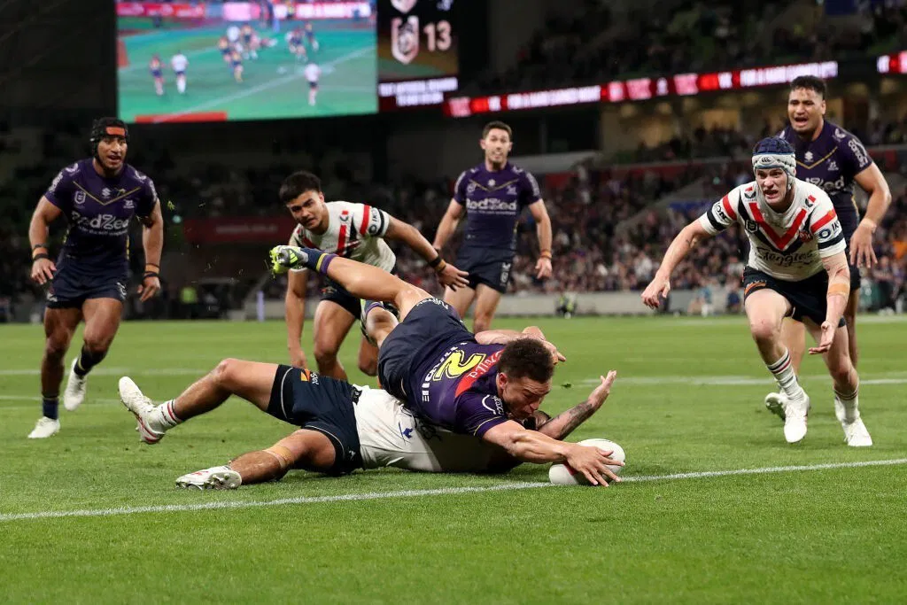 Melbourne Storm winger Will Warbrick scores a try against the Roosters.