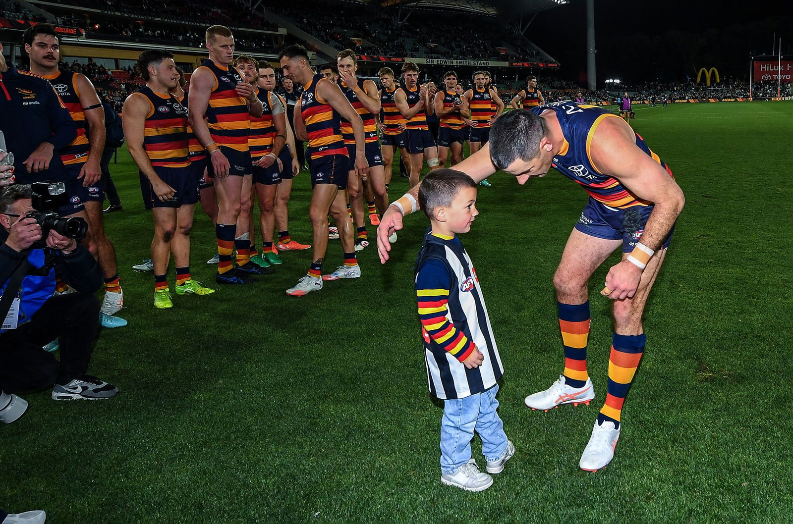 Taylor Walker with his son Louie after the final siren.