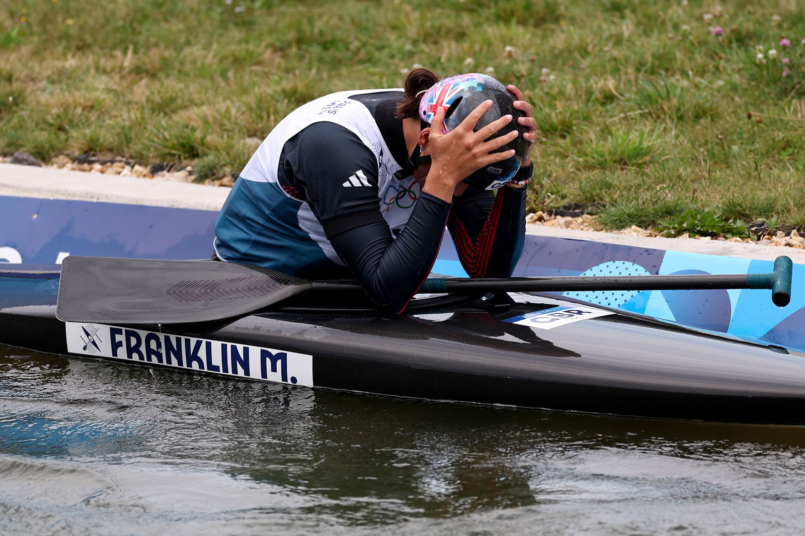 Mallory Franklin puts her hands on her heads after the C1 canoe slalom final.