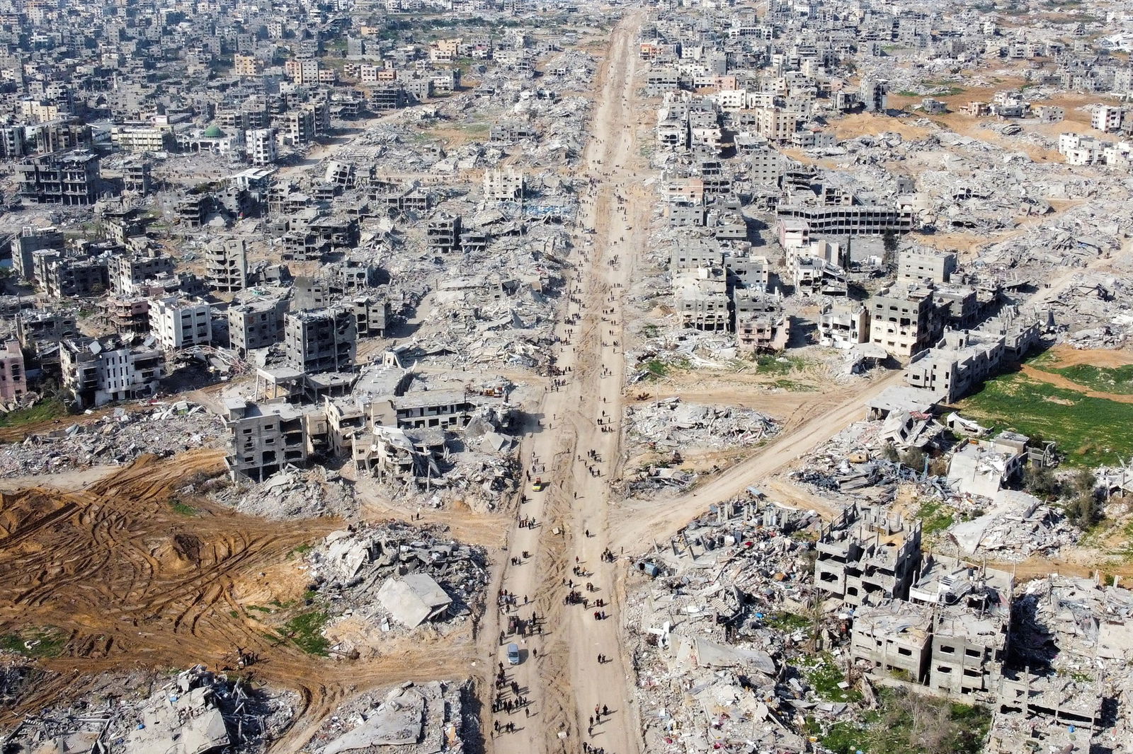 A drone shot of destroyed buildings. 