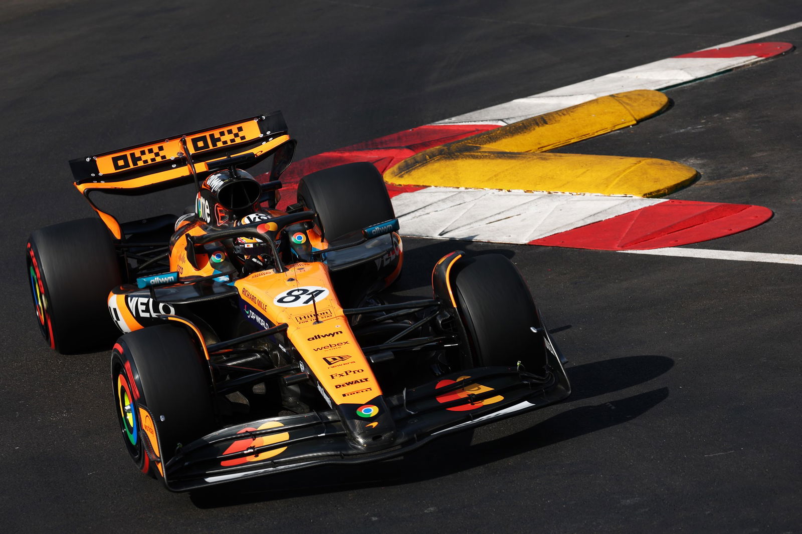 Oscar Piastri driving his F1 car through a chicane at the Monaco Grand Prix