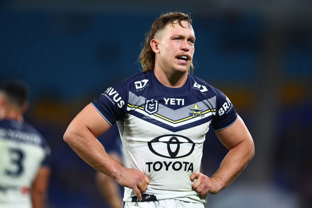 North Queensland Cowboys player Reuben Cotter puts his hands on his hips during an NRL game.