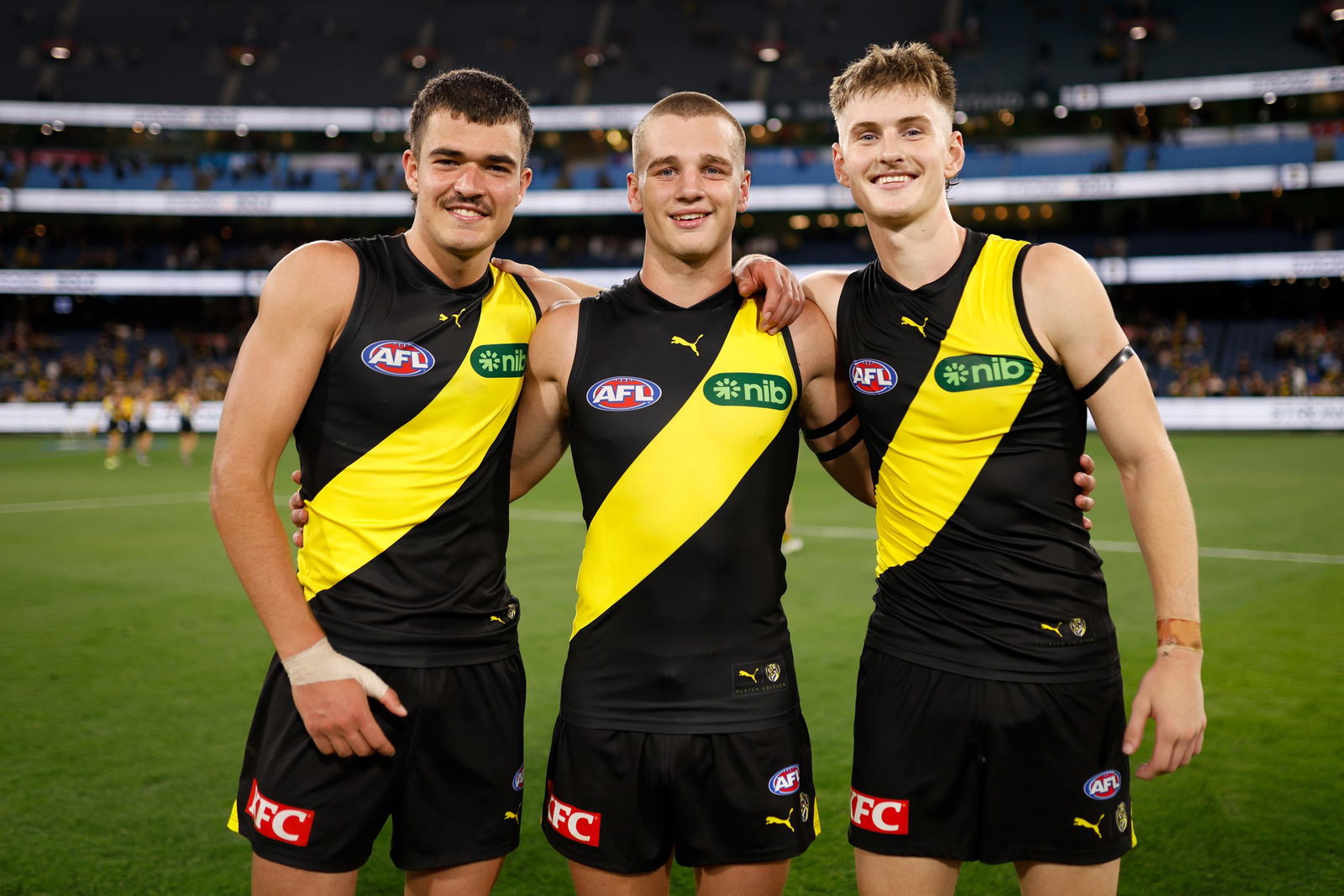 Harry Armstrong, Sam Lalor and Luke Trainor after Richmond defeated Carlton.