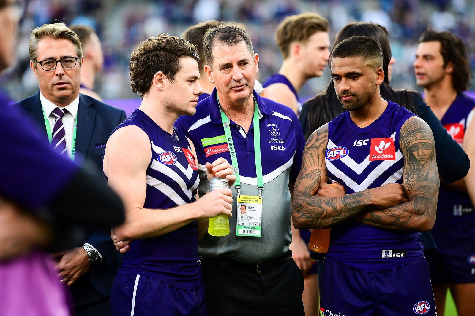 Â Ross Lyon, coach of the Dockers talks with Lachie Neale and Bradley Hill after the loss during the 2018 AFL round 23 match between the Fremantle Dockers and the Collingwood Magpies at Perth Stadium on August 25, 2018 in Perth, Australia.