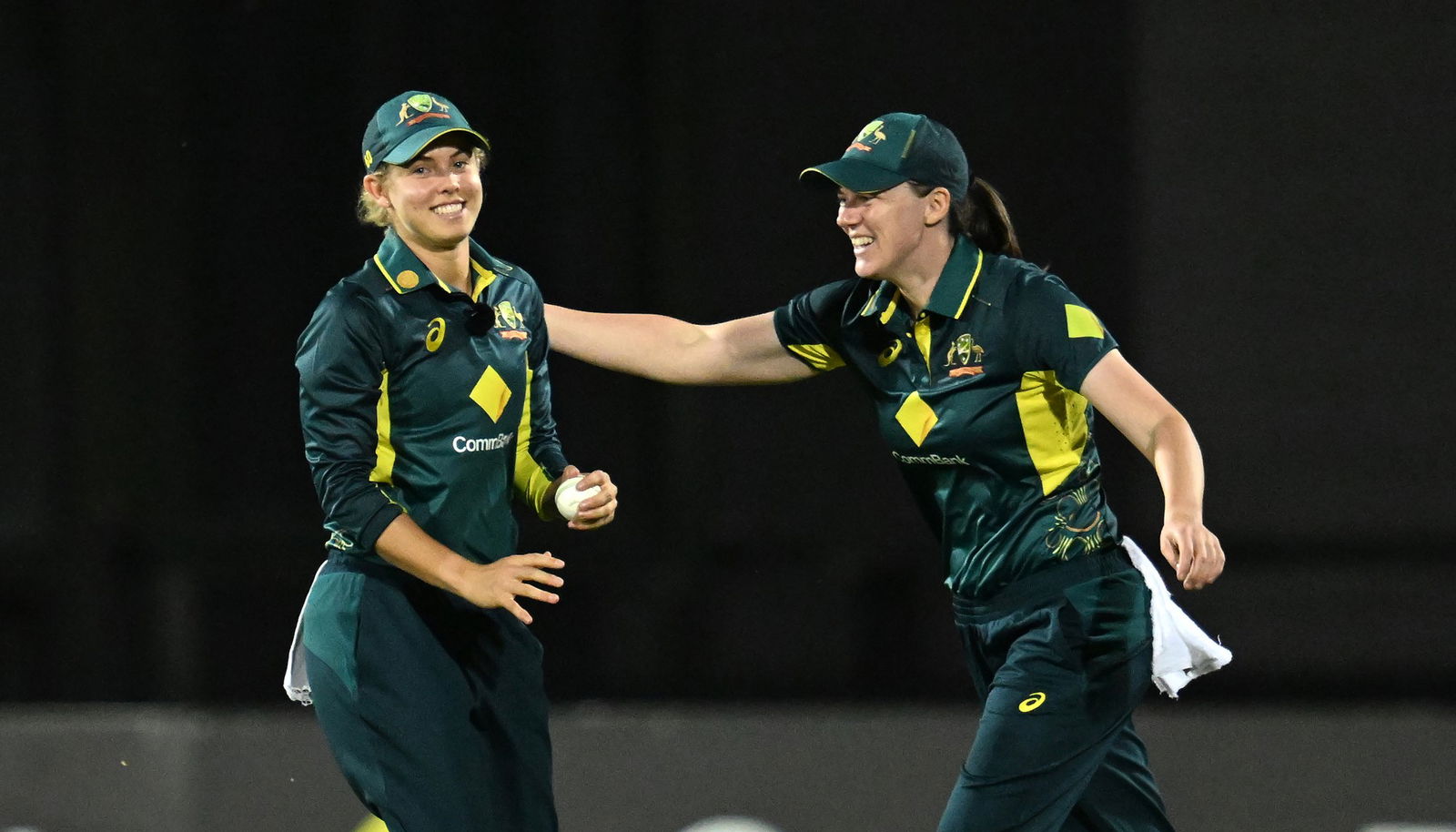 Phoebe Litchfield (left) of Australia celebrates with Tahlia McGrath (right) of Australia after taking a catch to dismiss Suzie Bates of New Zealand during the Second T20I match between Australia Women and New Zealand Women at Great Barrier Reef Arena in Mackay, Sunday, September 22, 2024.