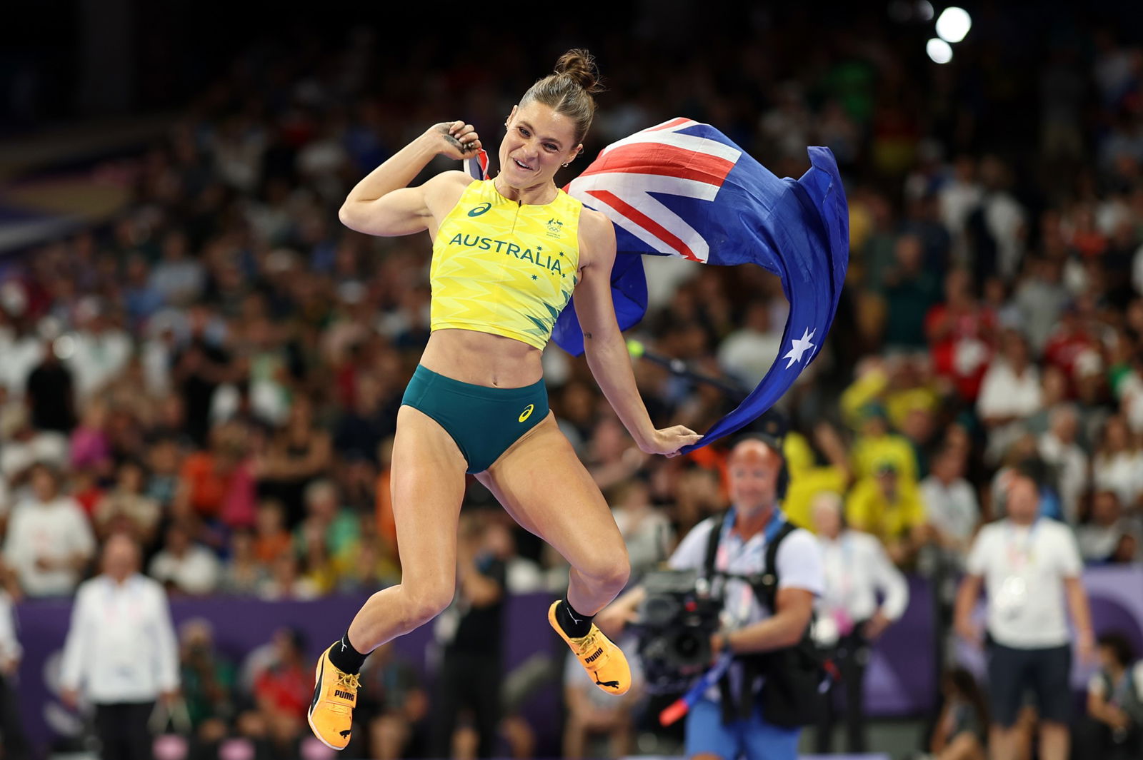 Australia's Nina Kennedy celebrates her win in the women's pole vault at the Paris Olympics.