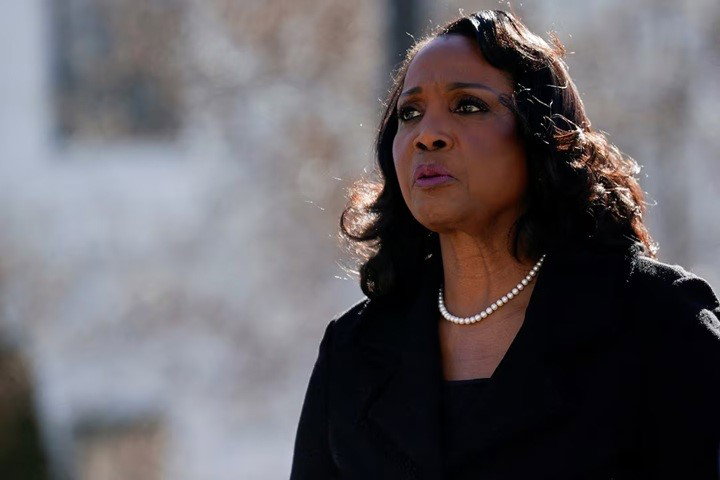 An African-American woman walks outside the US Supreme Court.