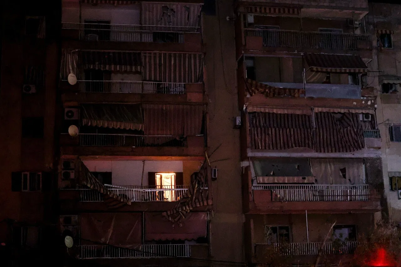 A fire can be seen inside an apartment building.