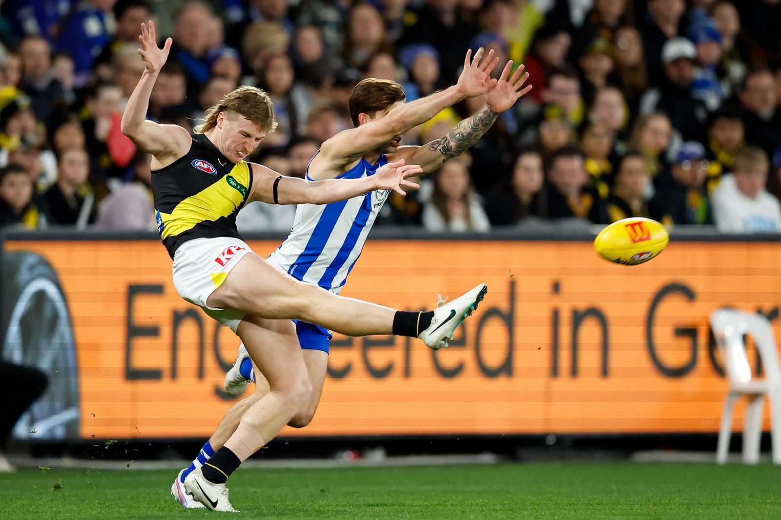Hugo Ralphsmith of the Tigers kicks the ball during the 2024 AFL Round 21 match between the North Melbourne Kangaroos and the Richmond Tigers at Docklands on August 03, 2024 in Melbourne, Australia..
