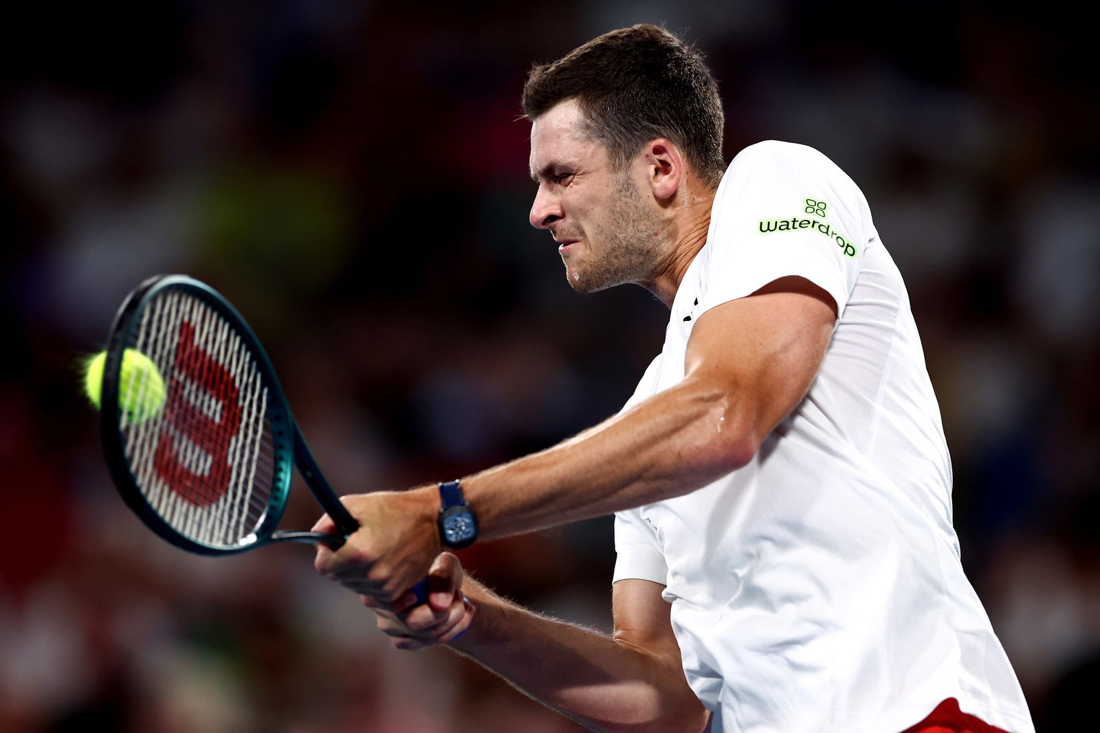 Hubert Hurkacz plays a backhand.