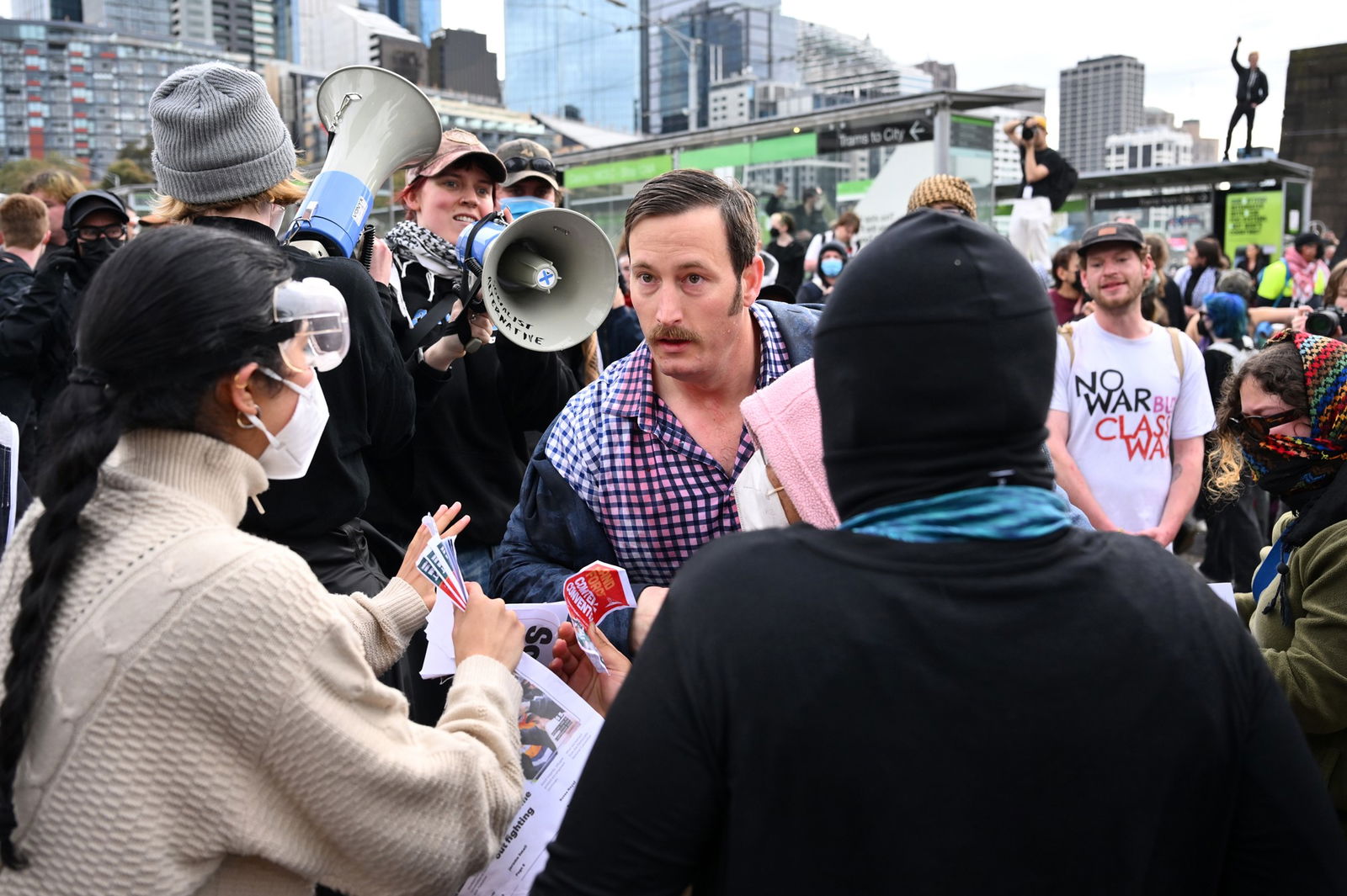 Protesters surrounding a man