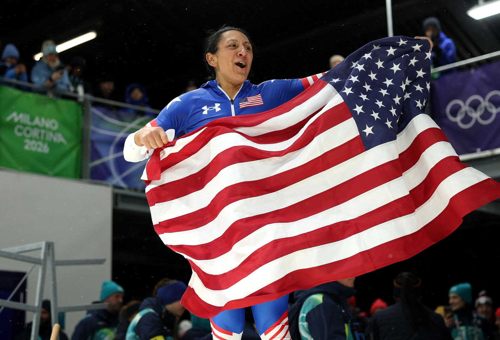 Elana Meyers Tayor celebrates with the US flag.