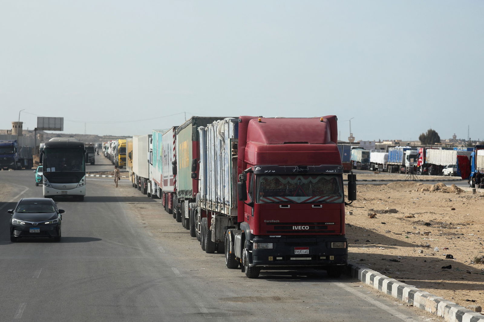 A line of trucks along the side of a road in Israel.