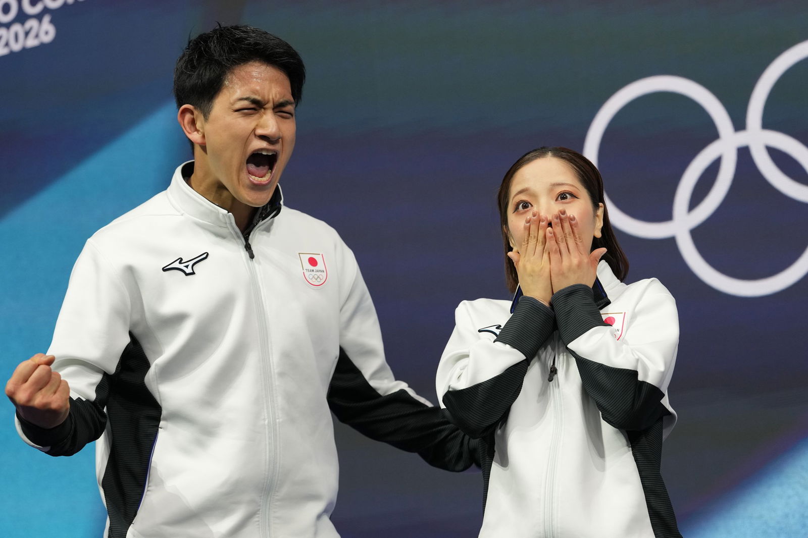 Riku Miura and Ryuichi Kihara celebrate at the Winter Olympics.