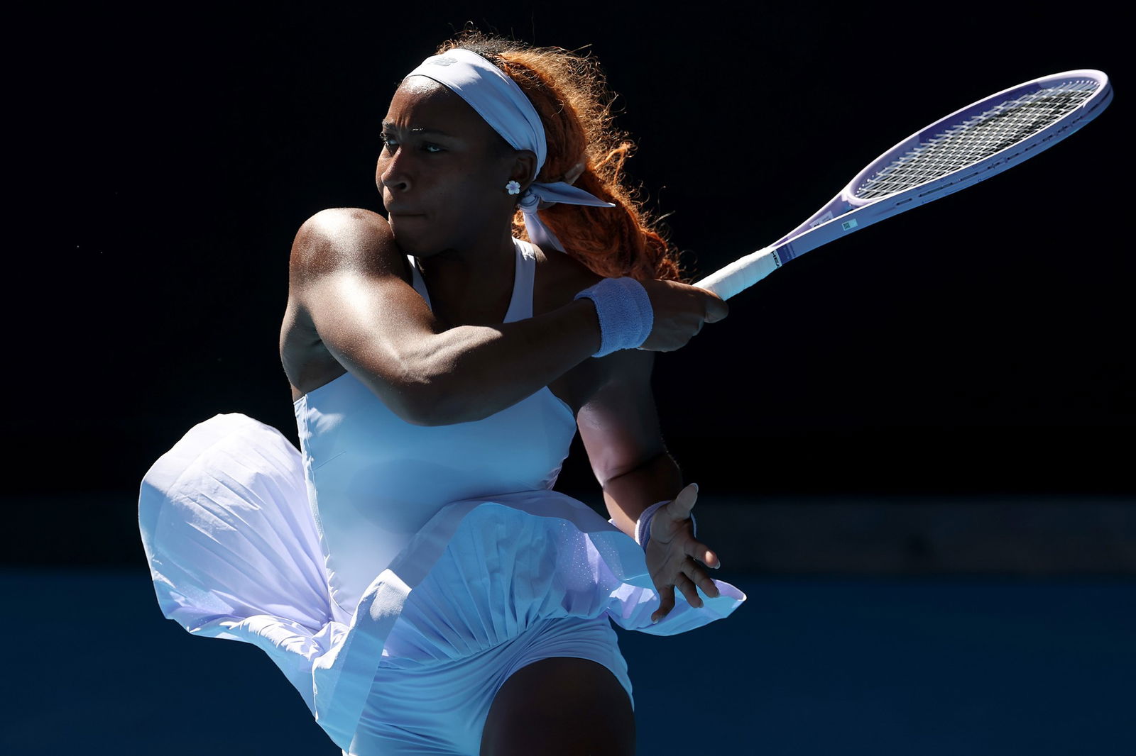 Coco Gauff of the United States plays a forehand against Hailey Baptiste of the United States in the Women's Singles Third Round during day six of the 2026 Australian Open at Melbourne Park on January 23, 2026 in Melbourne, Australia.