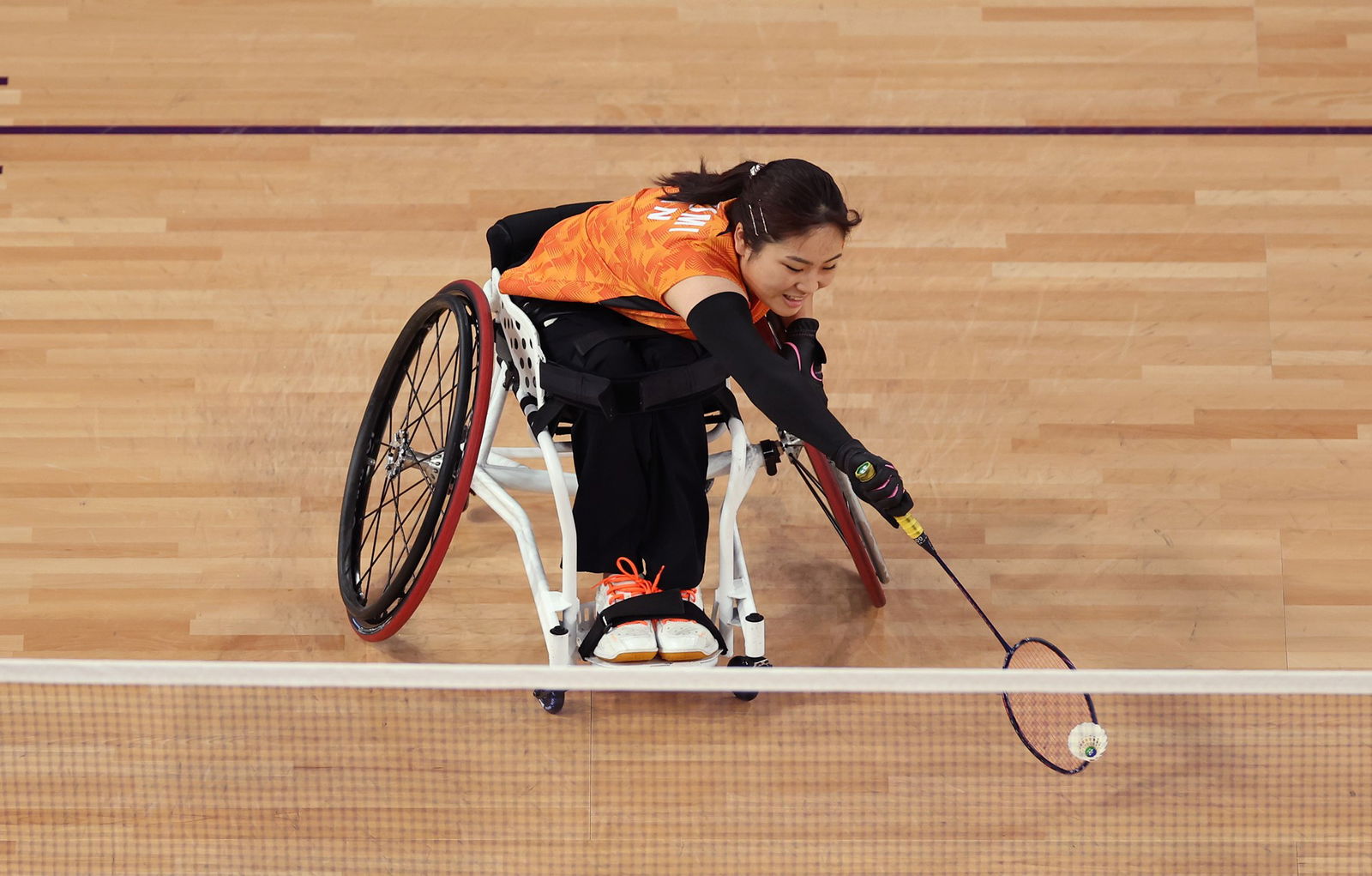 Sarina Satomi of Team Japan competes in the women's singles SH1 badminton gold medal match in Paris.