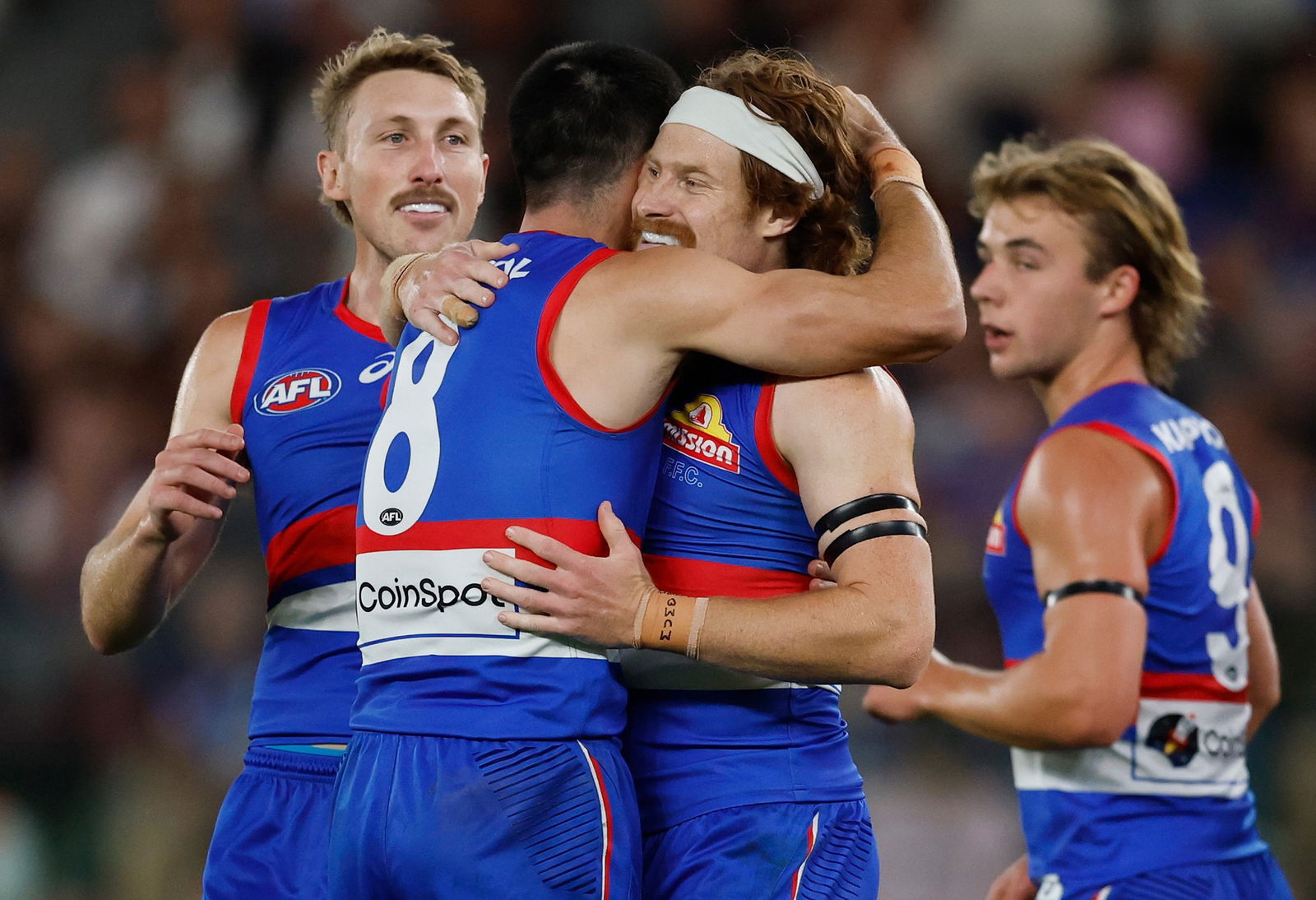 Bulldogs players celebrate a goal.