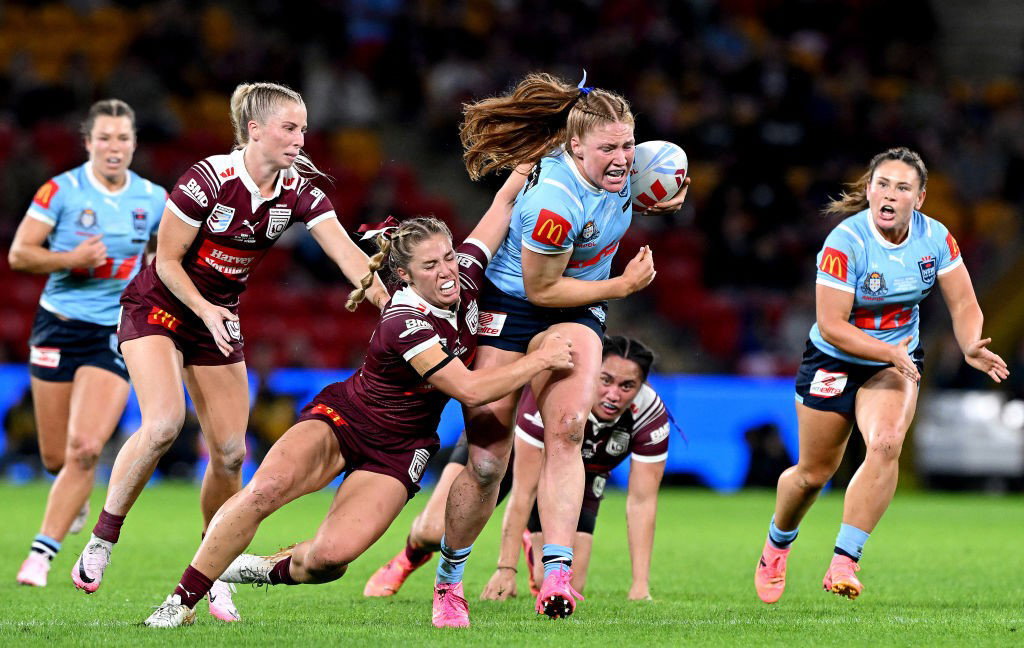 Grace Kemp runs into the Queensland defence for NSW in Women's State of Origin.