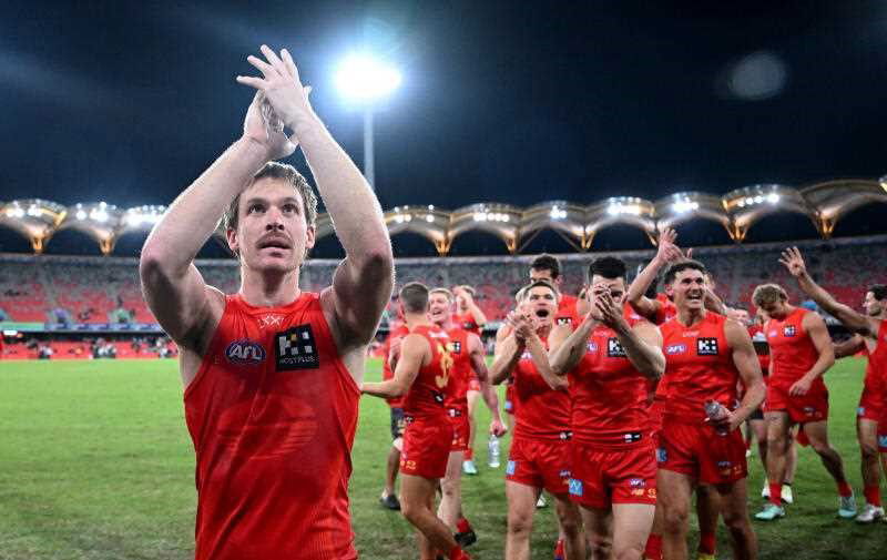 Suns captain Noah Anderson leads the team from the field following the AFL Round 18 match between the Gold Coast Suns and the Collingwood Magpies at Carrara Stadium on the Gold Coast, Friday, July 11, 2025.