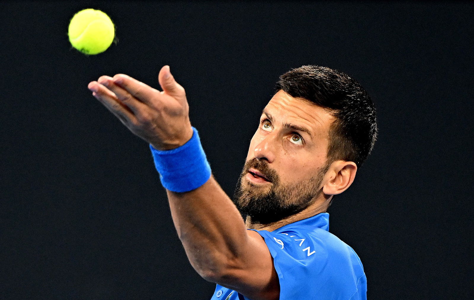 Novak Djokovic prepares to serve.