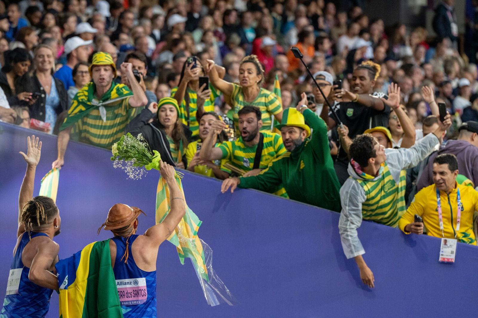 Brazil's Ricardo Gomes de Mendonca and Petrucio Ferreira Dos Santos celebrate their gold medals with fans in the Stade de France.