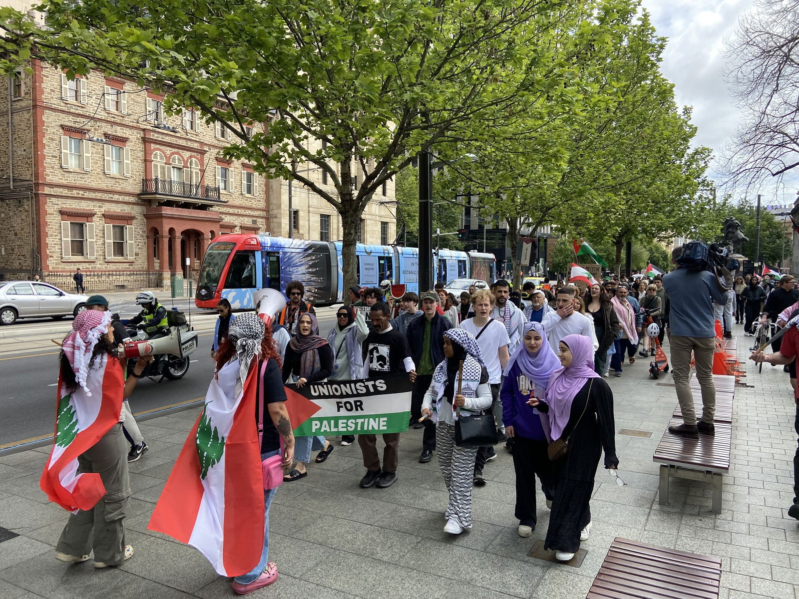 Protesters holding banners