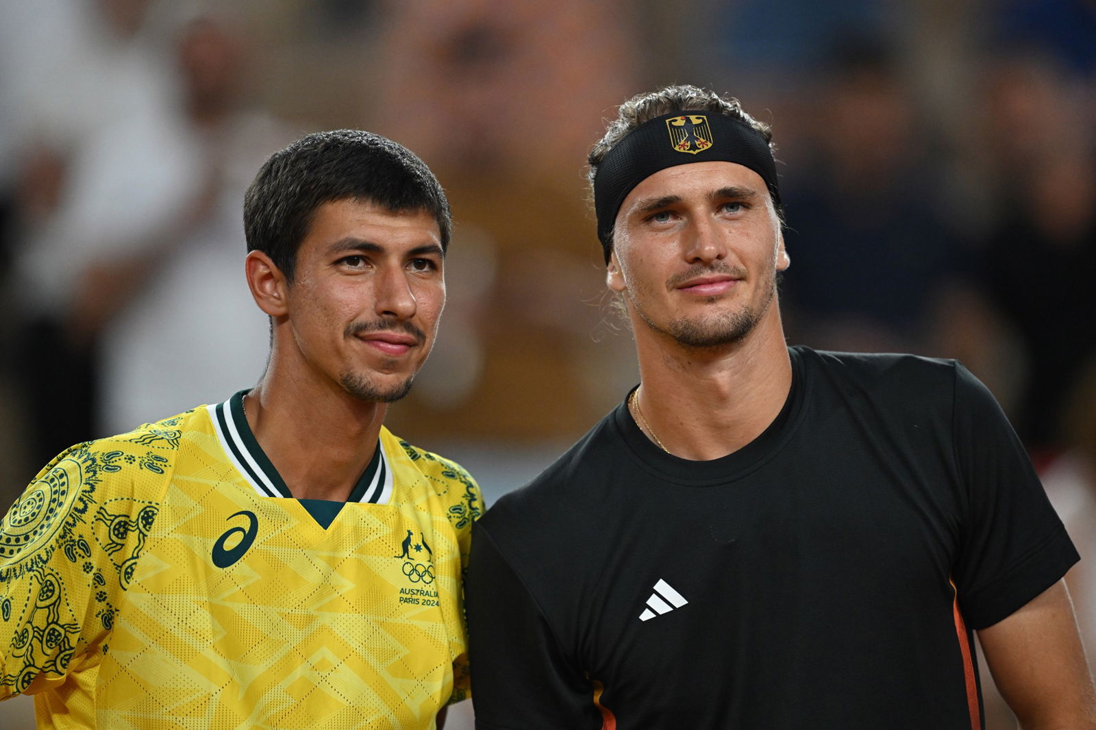 Australia's Alexei Popyrin and Germany's Alex Zverev pose for a picture before their men's singles match at the Olympics.