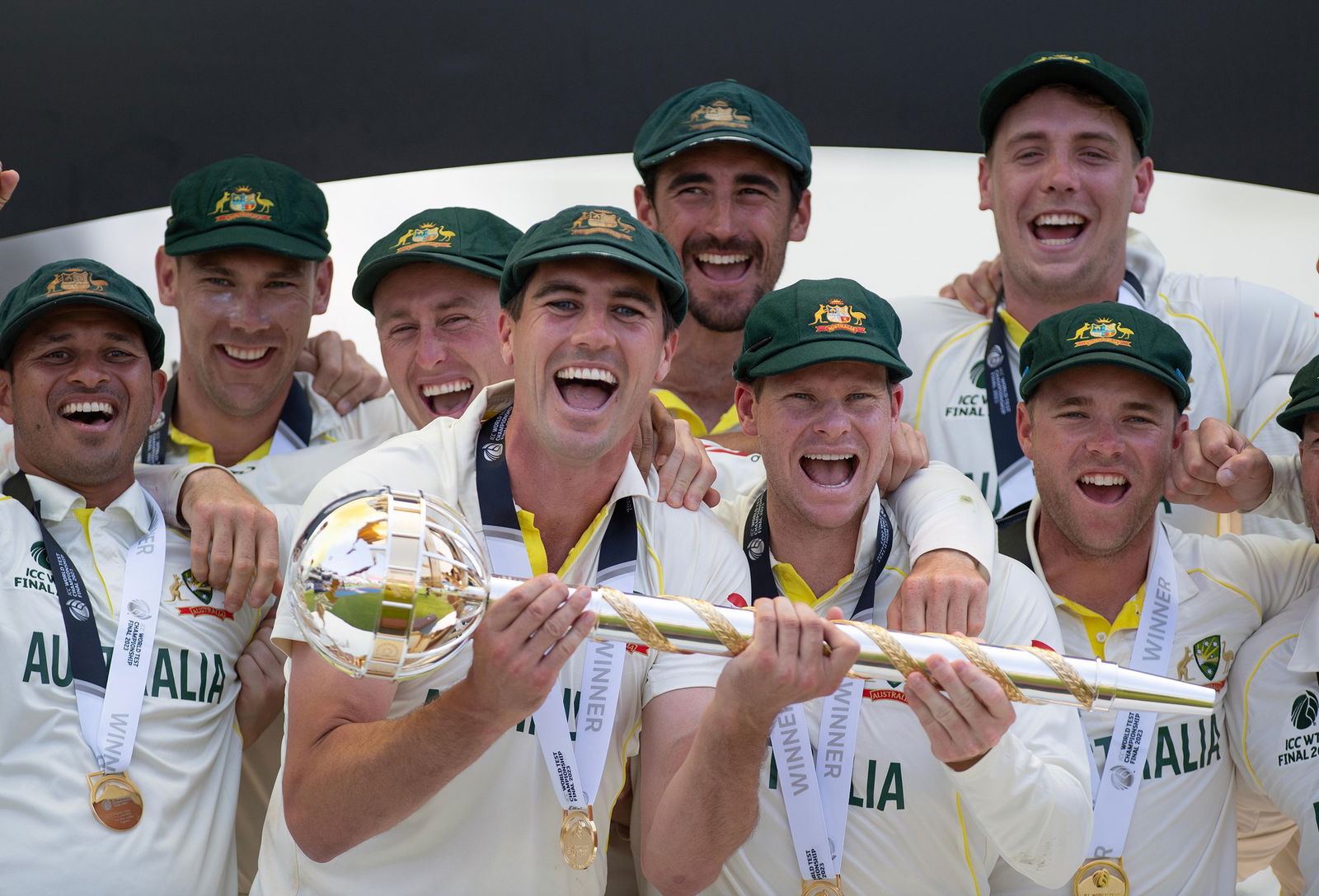 Pat Cummins and Australia celebrate with the World Test Championship trophy.