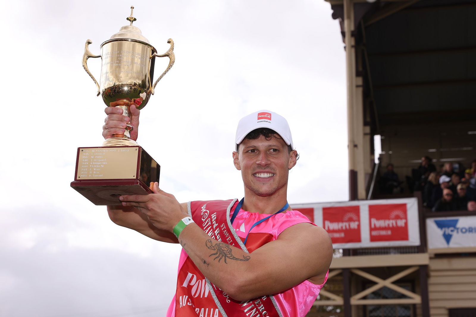 John Evans holds the men's Stawell Gift trophy.