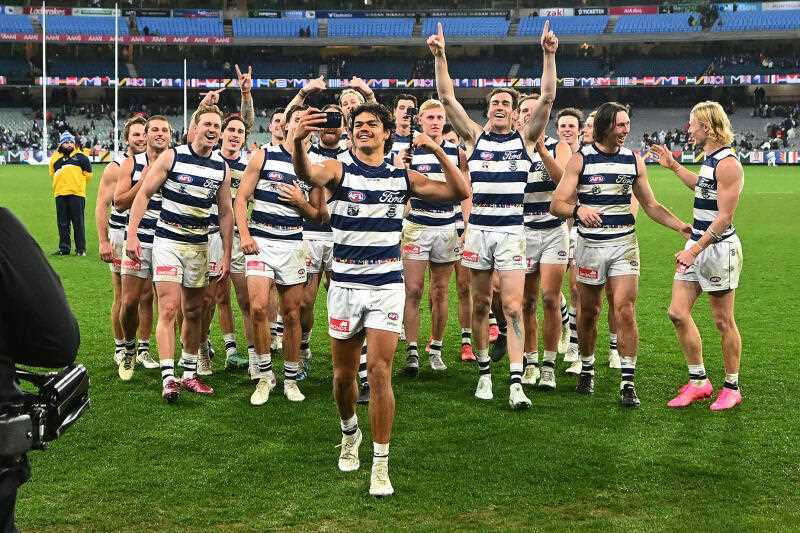 Lawson Humphries of Geelong celebrates a win over Essendon.
