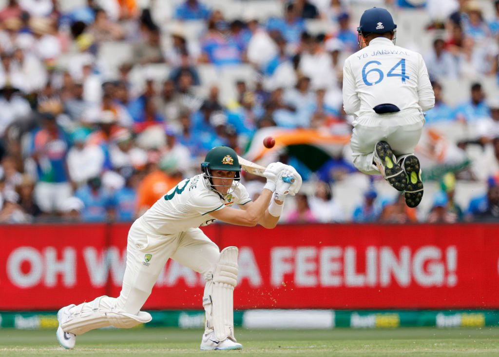 Marnus Labuschagne sl;aps through cover as Yashasvi Jaiswal jumps out of the way.