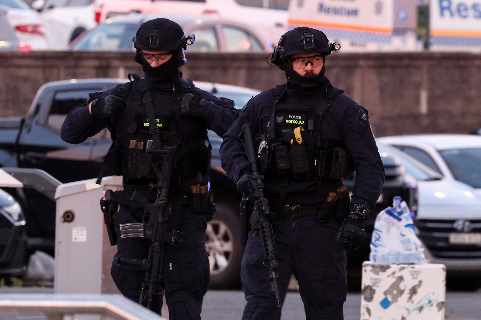 Armed police work at the scene after a shooting incident at Bondi Beach in Sydney 